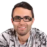 a man wearing glasses and a black and white shirt