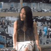 a woman is sitting in front of a window with imgflip.com written on the bottom