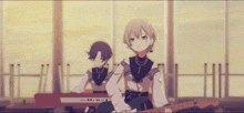 a girl playing a guitar next to another girl playing an electronic keyboard