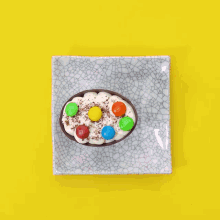 a person is putting a chocolate bar on a plate