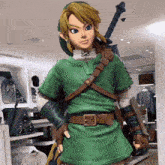 a statue of link holding a sword and a shield