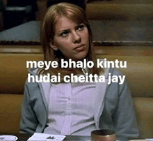 a woman is sitting at a table with the words meye bhalo kintu hudai cheitta jay on the bottom