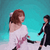 a woman in a white off the shoulder top is dancing on a blue background .