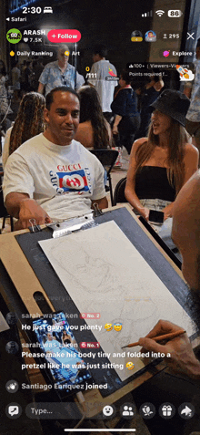 a man in a gucci shirt is sitting at a table drawing