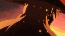 a close up of a person 's face with fire coming out of it