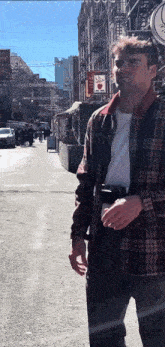 a man walking down a street with a sign that says solo