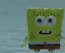 a blurry picture of a yellow spongebob squarepants cartoon character .