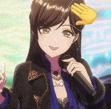 a girl in a black jacket is holding a microphone and smiling