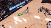 a basketball court with progressive advertisements on the side