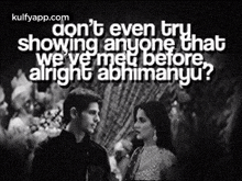 a man and a woman are standing next to each other in a black and white photo with a quote on it .