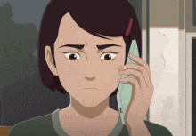 a woman is talking on a cell phone and making a face