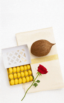 a card that says happy guru pournima with a box of yellow balls and a rose