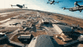 a bunch of drones are flying over a building with the word veo on the bottom right