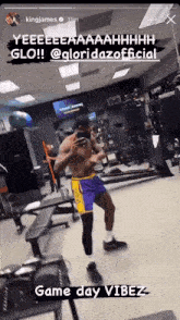 a man taking a picture of himself in a gym