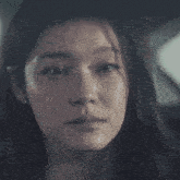 a woman with a tear running down her cheek