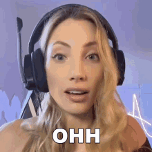 a woman wearing headphones with the word ohh written on her face