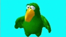 a green parrot is holding a piece of cheese in its hand .