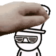a hand is touching the face of a cartoon character wearing sunglasses .