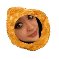 a woman 's face is visible through a hole in a fried onion ring