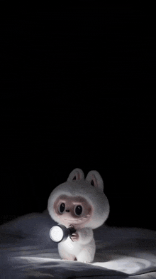 a cartoon character is holding a flashlight in its hand