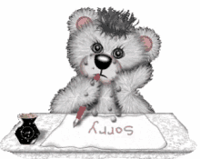 a teddy bear is sitting at a table writing sorry