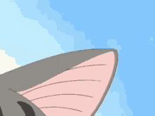 a close up of a cartoon cat 's face with pink dots coming out of its eyes .