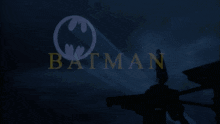 a dark blue background with the word batman in yellow letters
