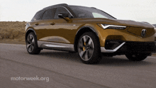a car is driving down a road with motorweek.org written on the bottom right