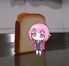 a little girl with pink hair is standing next to a loaf of bread