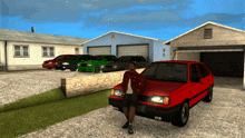 a man is standing next to a red car in front of a garage