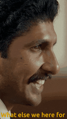a close up of a man 's face with the words " what else we here for " below him