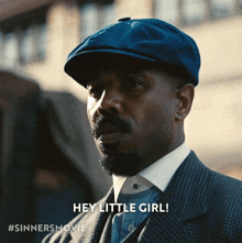 a man wearing a hat says hey little girl
