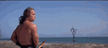 a man is holding a fishing rod with hooks on it