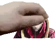 a close up of a person 's hand holding a red scarf over a person 's head .