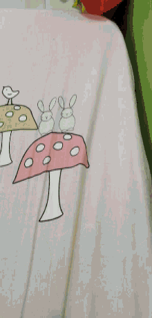 a close up of a pink and white item with a red background .
