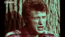 a close up of a man 's face with the words melody on the bottom