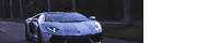 a sports car is driving down the road at night