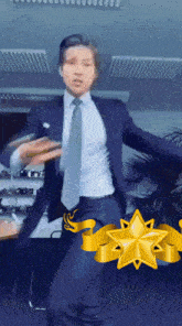 a man in a suit and tie is dancing with a star in the background