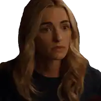 a close up of a woman 's face with a serious look on her face