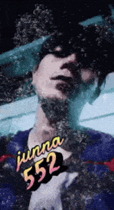 a close up of a person 's face with the words junna 552 above it
