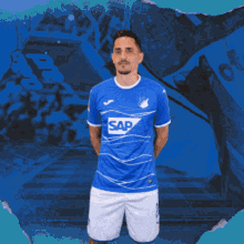 a man in a blue shirt with sap on it