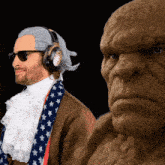 a man wearing headphones stands next to a statue of a man