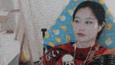 a woman is sitting in a chair wearing headphones .