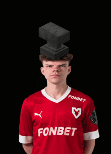 a man wearing a red fonbet jersey with a pyramid on his head