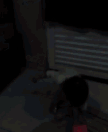 a blurry picture of a child laying on a bed in front of an air conditioner