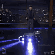a gif of a person jumping in the air with the gifpy logo in the upper right corner