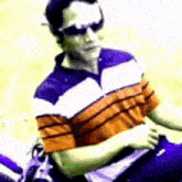 a man wearing sunglasses is sitting on a golf cart .