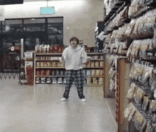 a person is dancing in a grocery store