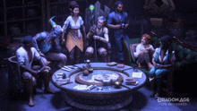 a group of people sitting around a table with dragon age the veilguard written on it