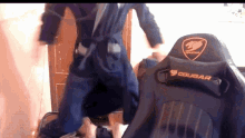 a cougar gaming chair is sitting in front of a person